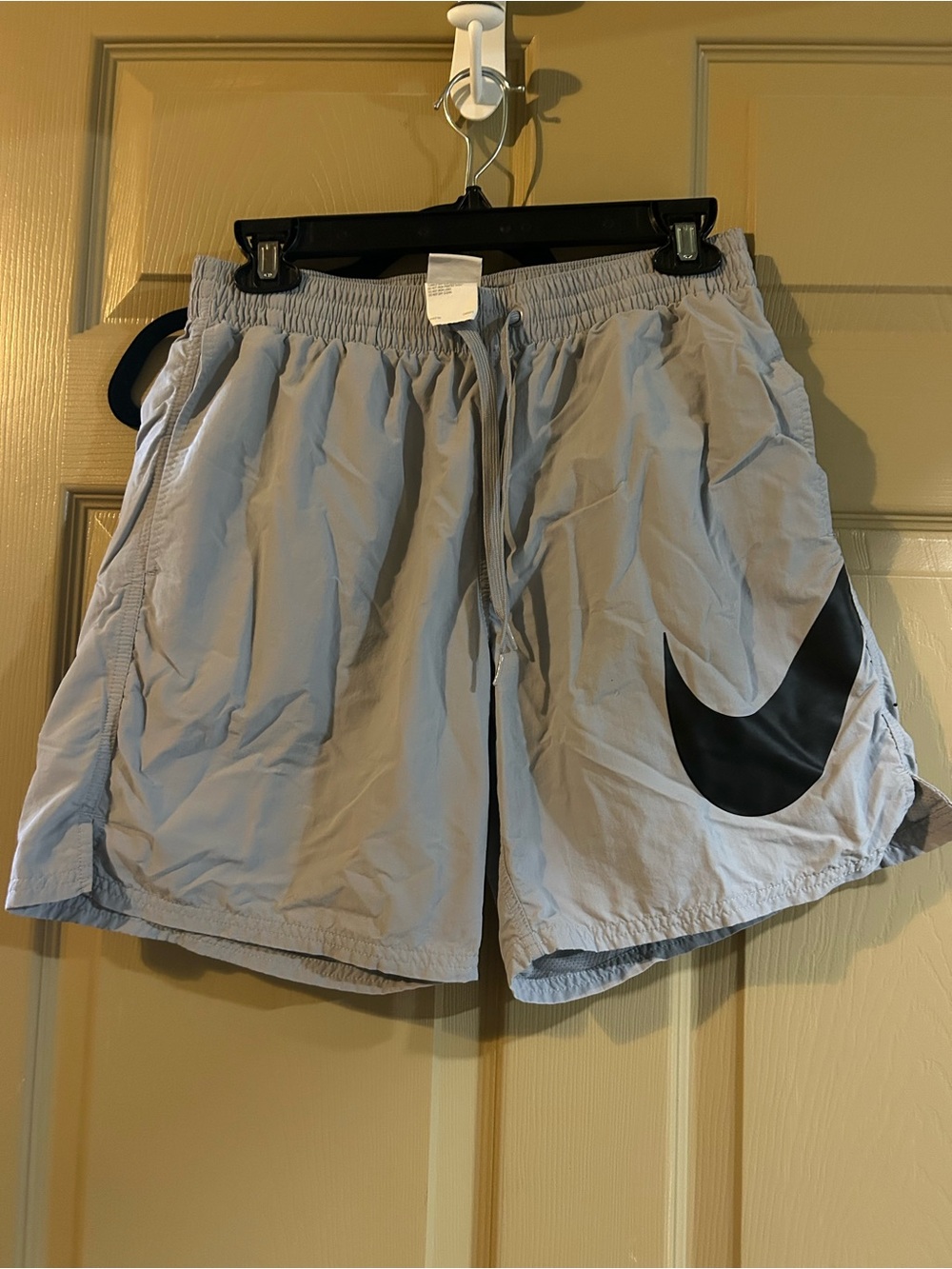 Nike Light Gray Athletic Shorts with Black Swoosh